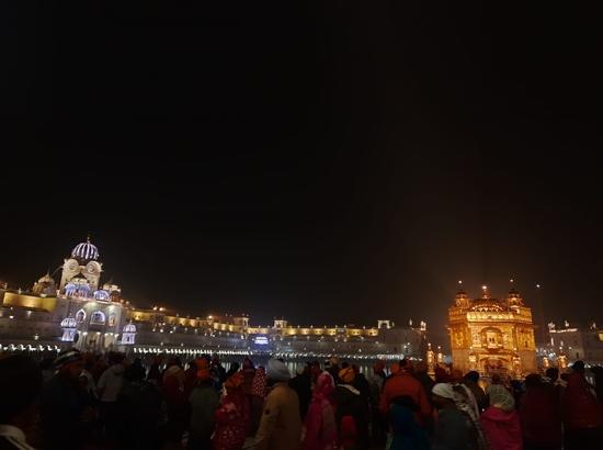 A large number of devotees pay obeisance at Golden Temple during New Year... by Gurmeet Kaur