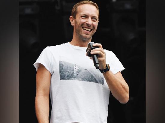 Chris Martin falls through stage trap door while performing with Coldplay in Australia