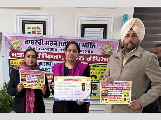 DC Amarpreet Sandhu unveils road safety rules poster