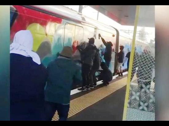 Masked youth gang spray-paint Auckland train with graffiti 