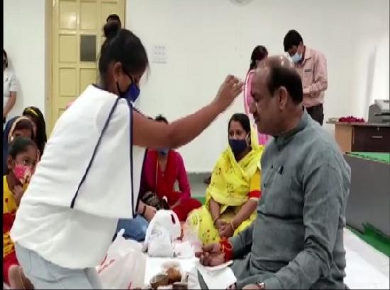 Women who lost husbands or parents to COVID-19 tie rakhis to Om Birla