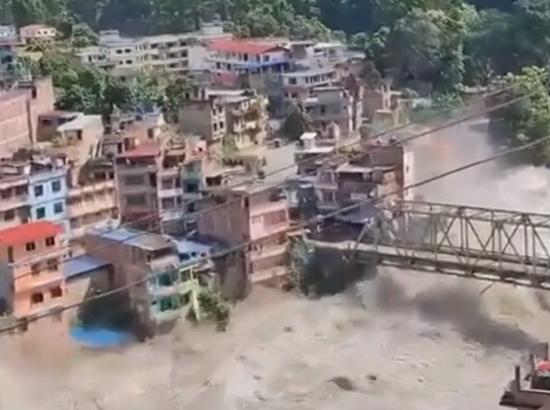 Breaking: Flash flood sweeps through Northern Nepal, damages homes, bridges; Casualties feared; Watch Video
