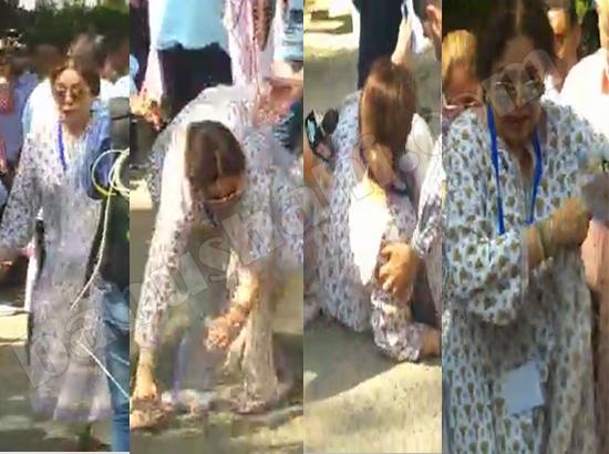 BJP candidate Kirron Kher trips on way to cast her vote (watch video)
