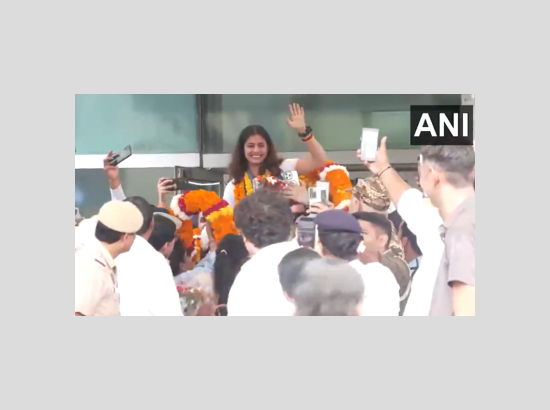 #WATCH | Double Olympic medalist in shooting, Manu Bhaker and her coach Jaspal Rana receive a grand welcome after they arrive at Delhi airport