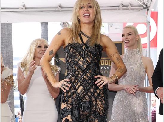 Miley Cyrus receives Hollywood Walk of Fame star, channels vintage glamour in Heidi Klum's former Versace look